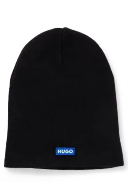Gorro de punto de algodón con etiqueta con logo azul