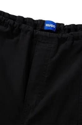 Pantalones oversize fit de estilo paracaídas en popelín de algodón