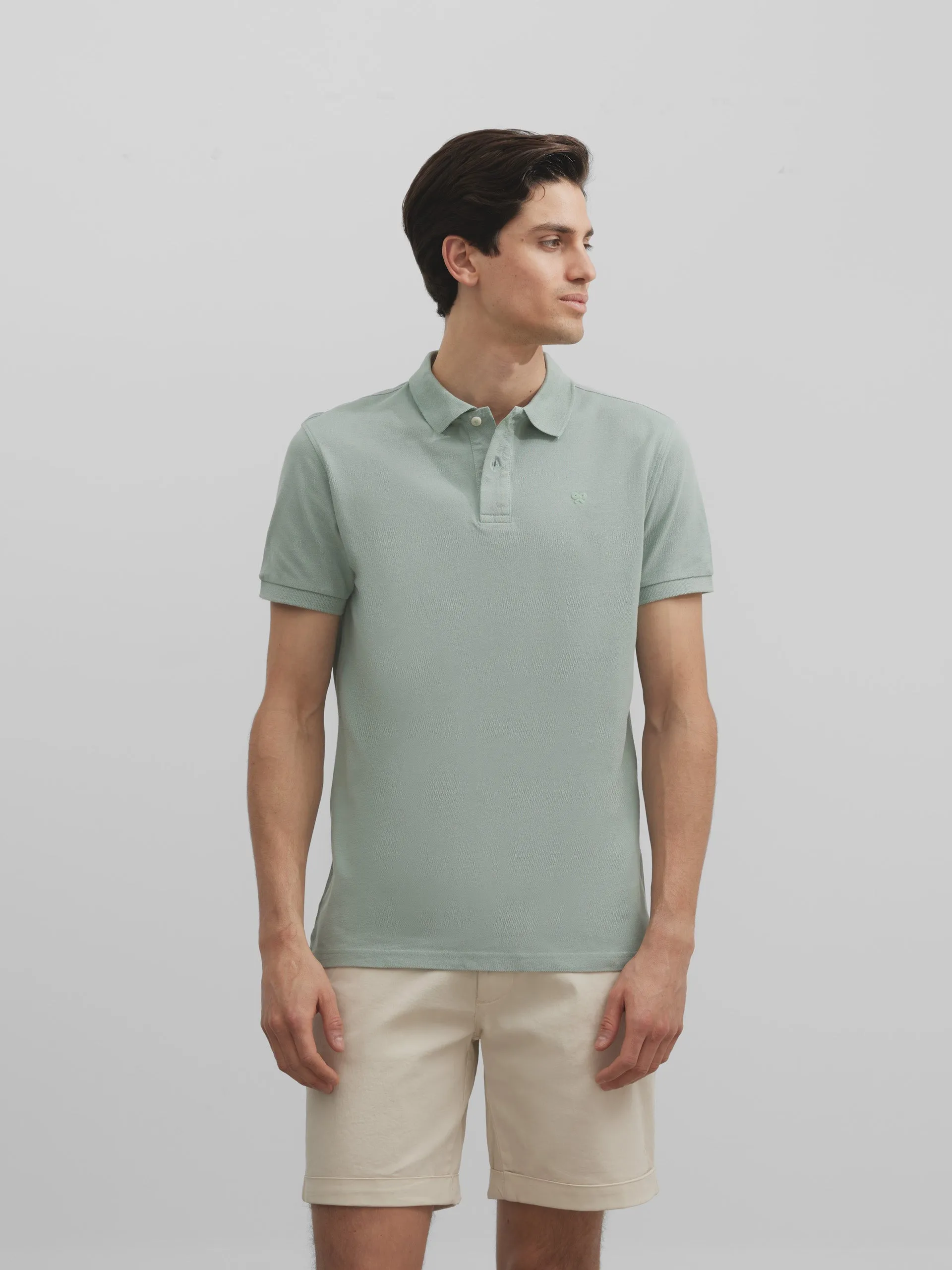 Polo liso logo medio verde