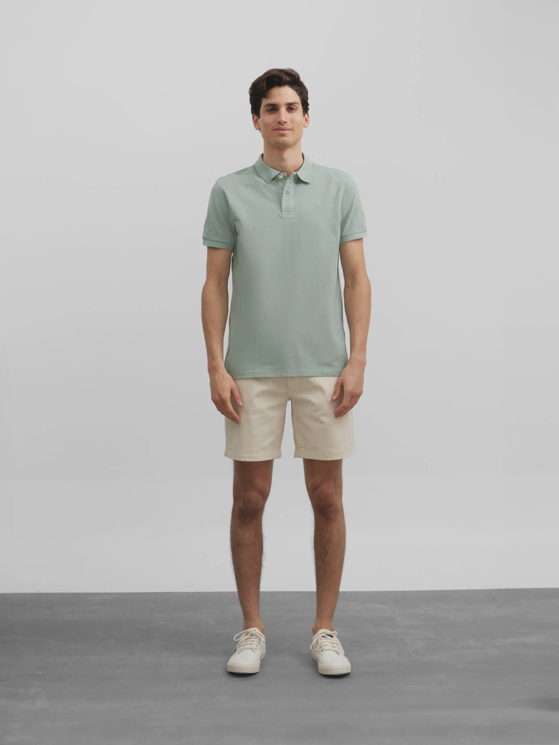 Polo liso logo medio verde
