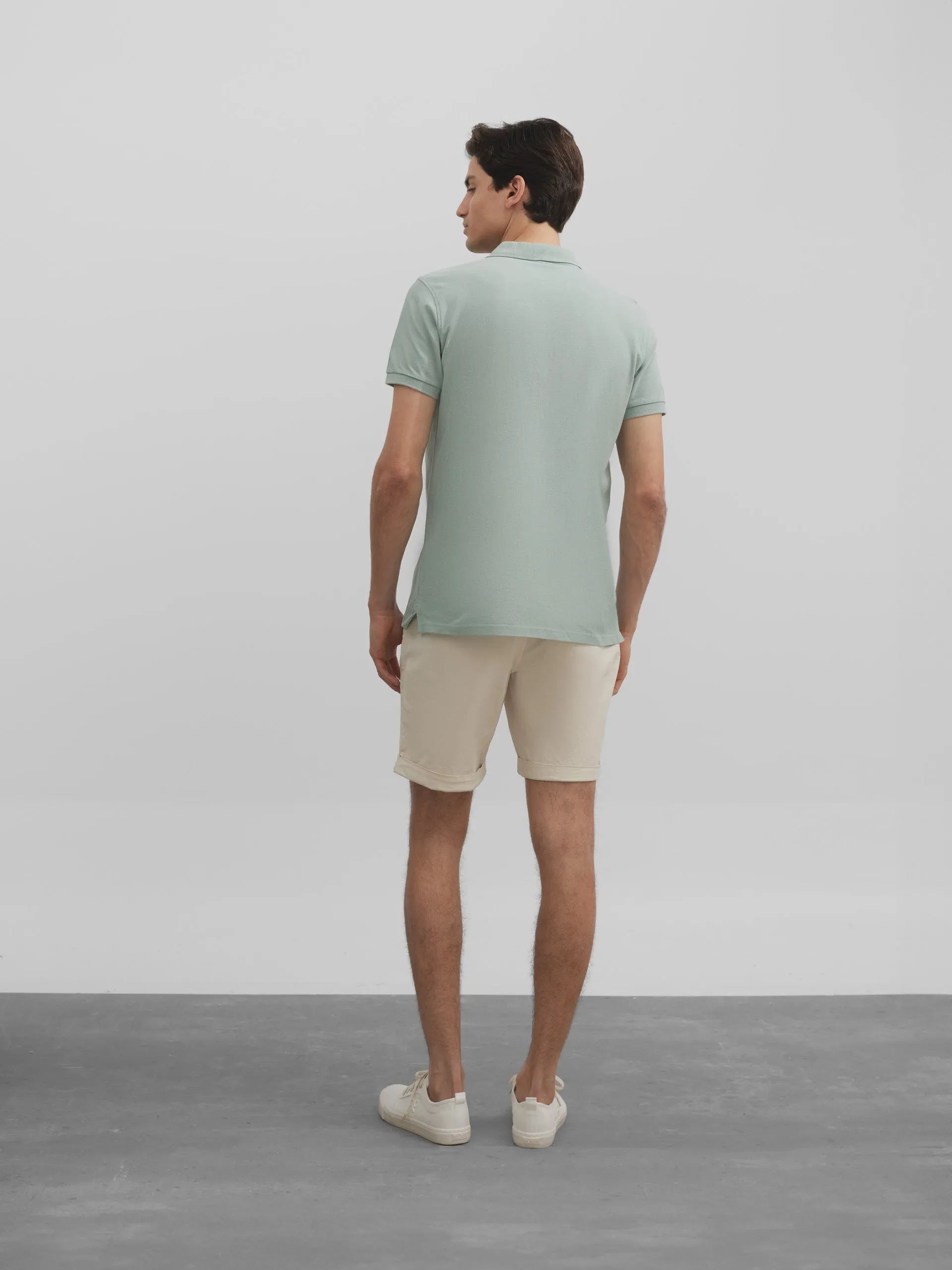 Polo liso logo medio verde