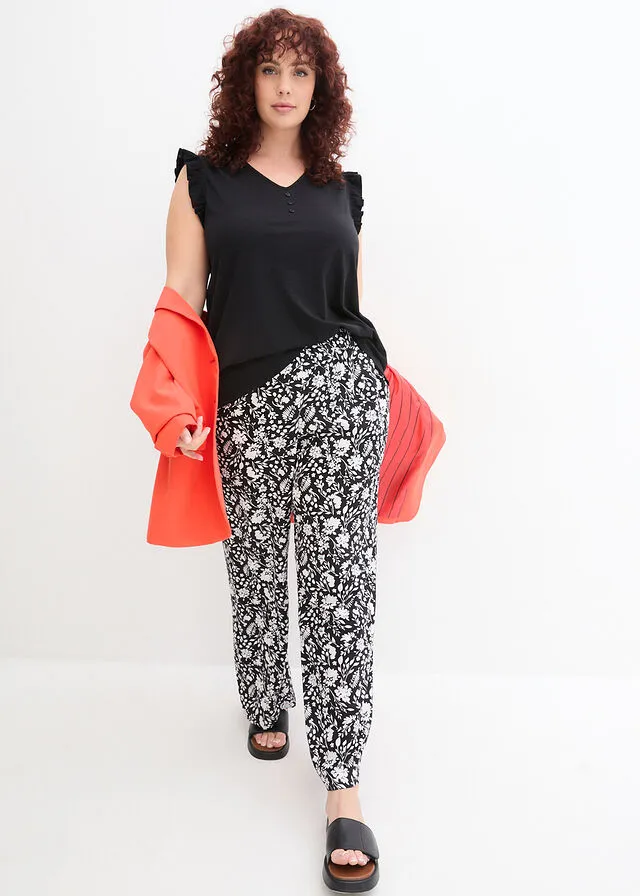 Top de hilo flameado de algodón con detalle de volante Negro